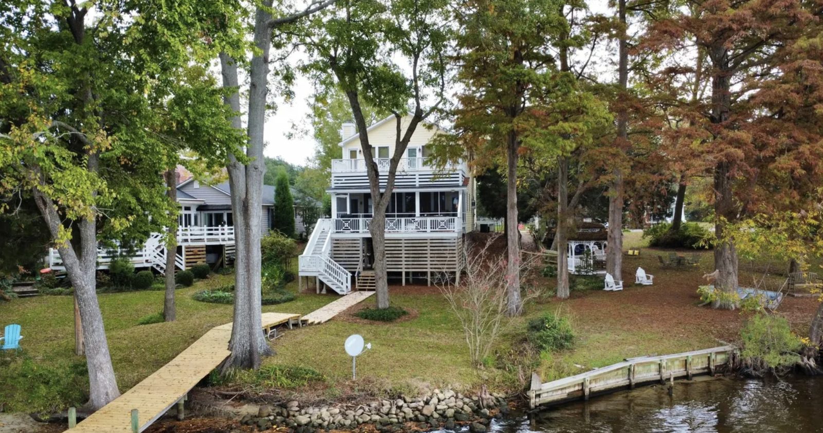 Waterfront view of 107 S Main St in Bath, NC, showing the pier and boat slips on Bath Creek